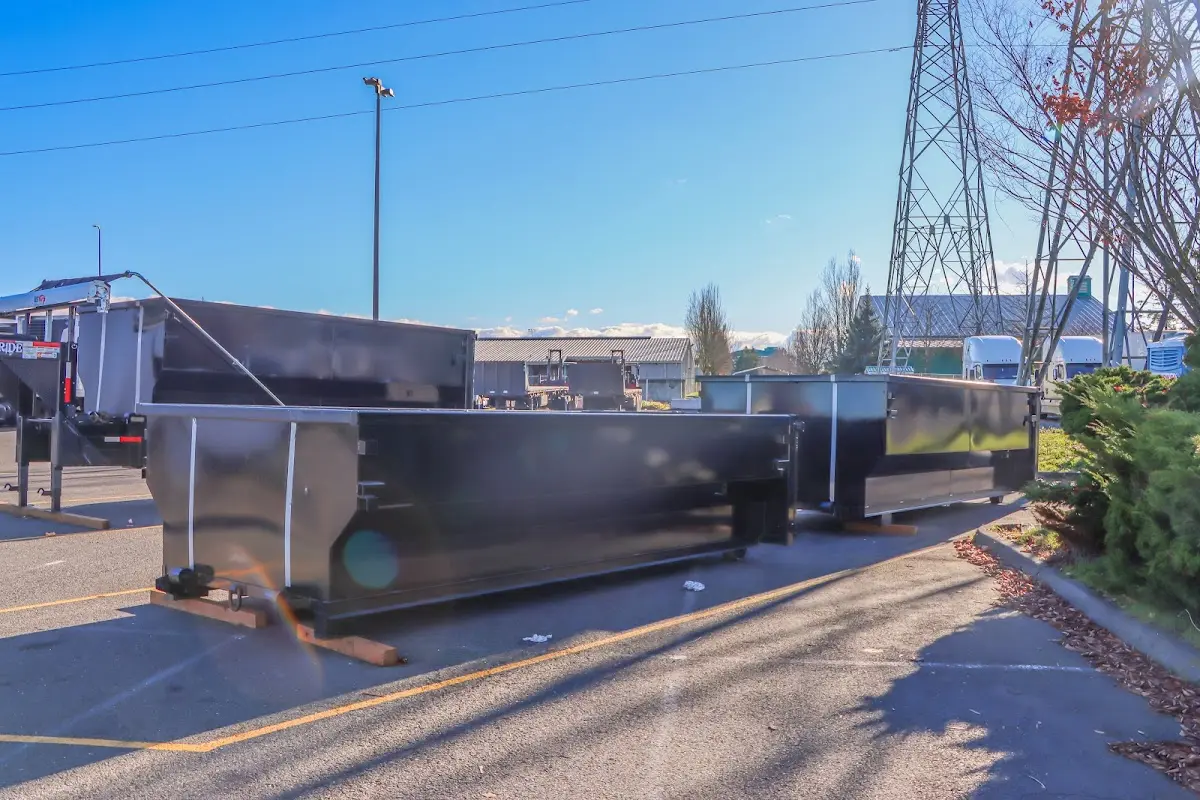 Roll-off dumpster ready for waste disposal at job site for 2 Yard Dumpster Rental in Hilton